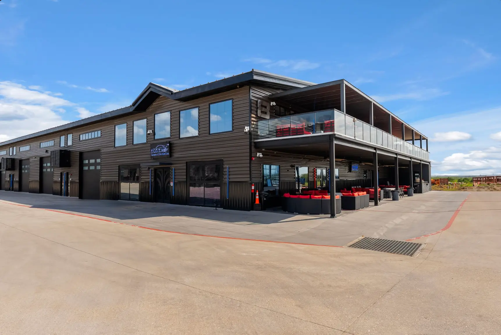 GOTA clubhouse exterior with covered patio and upper deck